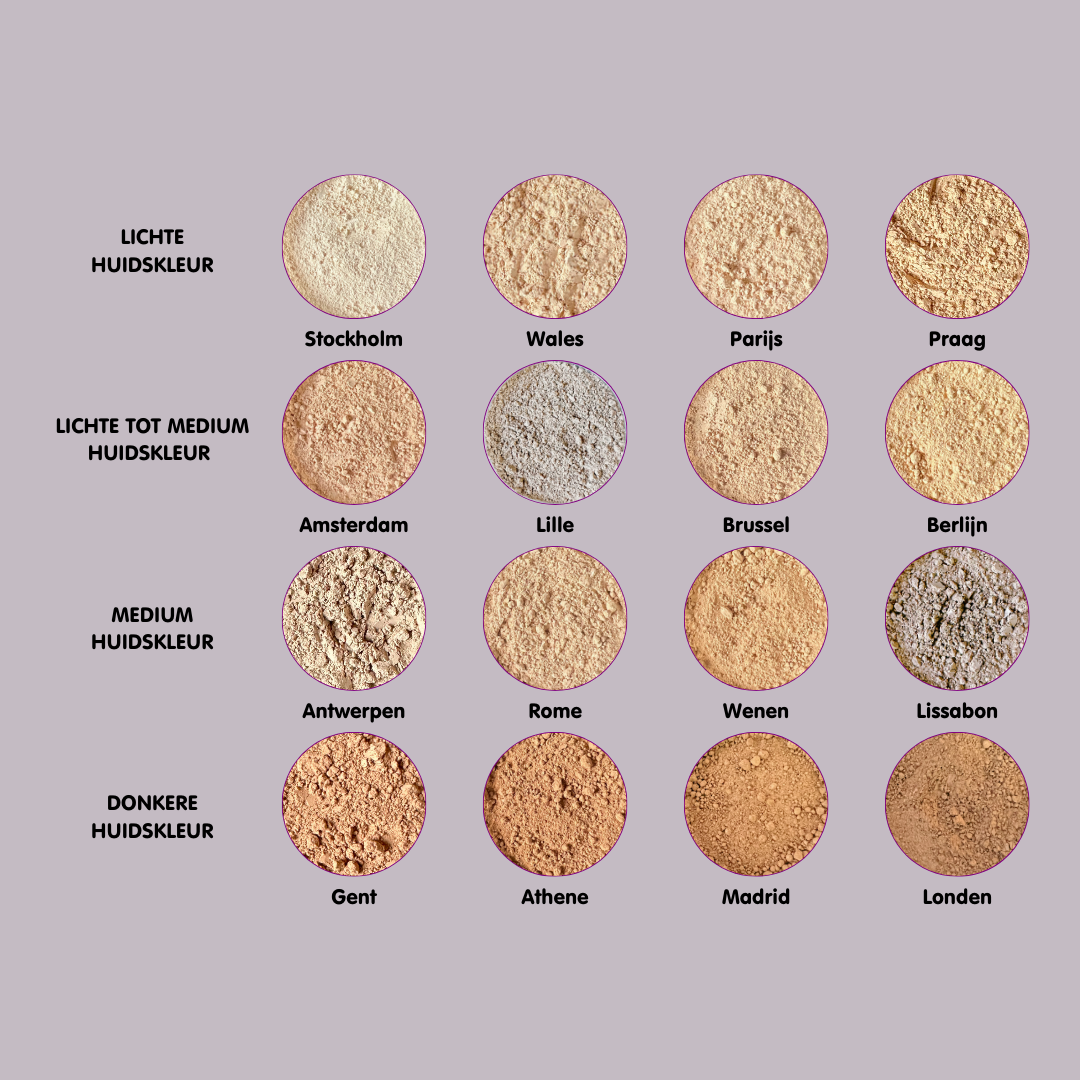 Overzicht van een palet minerale make-up foundations in diverse tinten, variërend van lichte tot donkere kleuren, met een natuurlijke, losse poedertextuur.